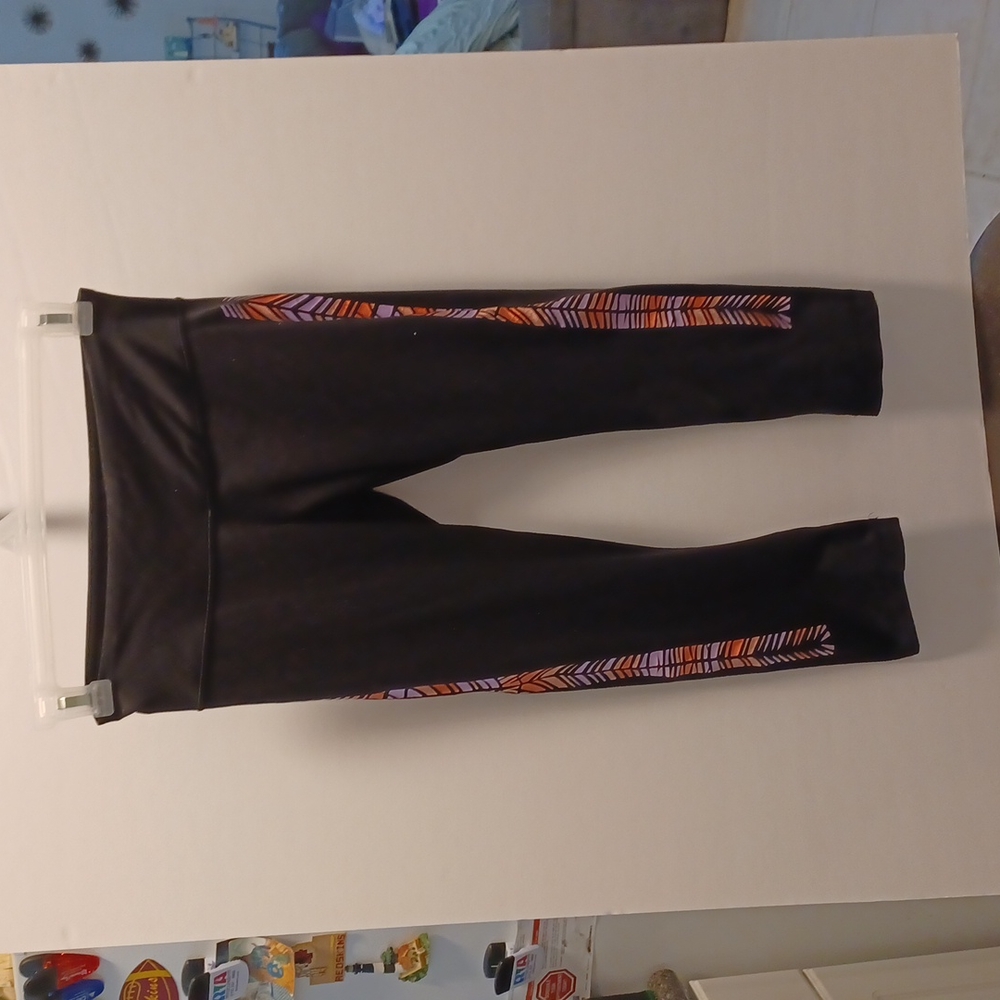 Lululemon Athletica black leggings with stained glass look on sides